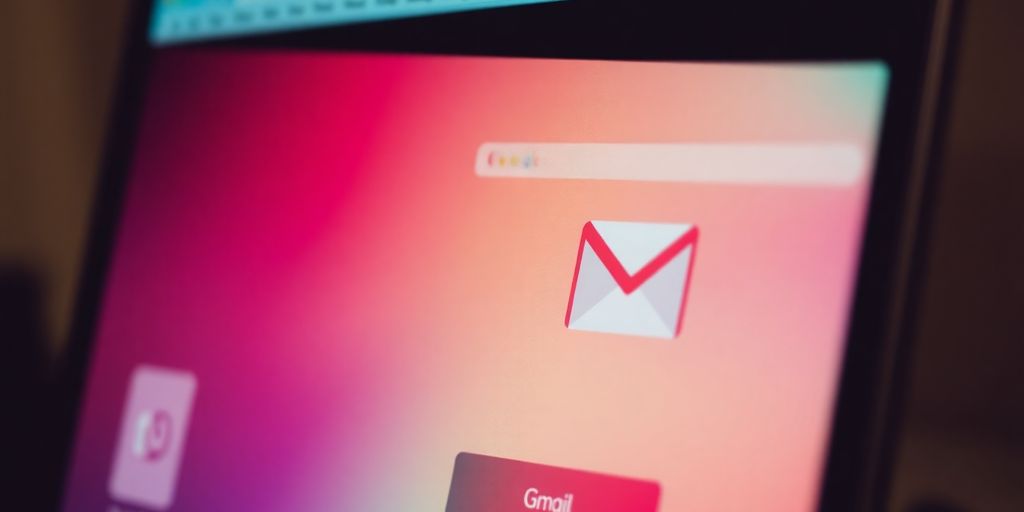 Close-up of a fake Gmail inbox on a screen.